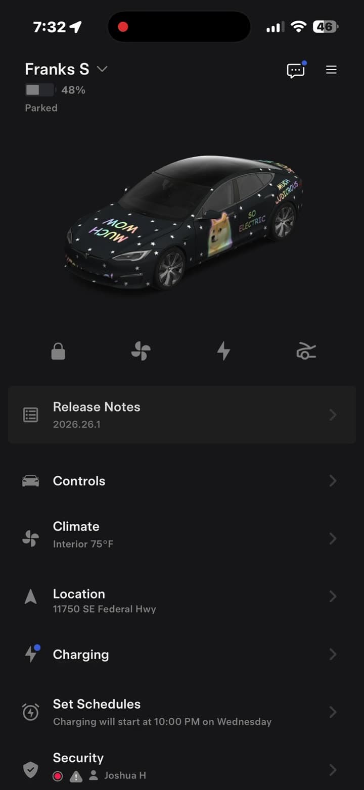 The Tesla app home screen showing a Model S wearing a custom black wrap with doge artwork