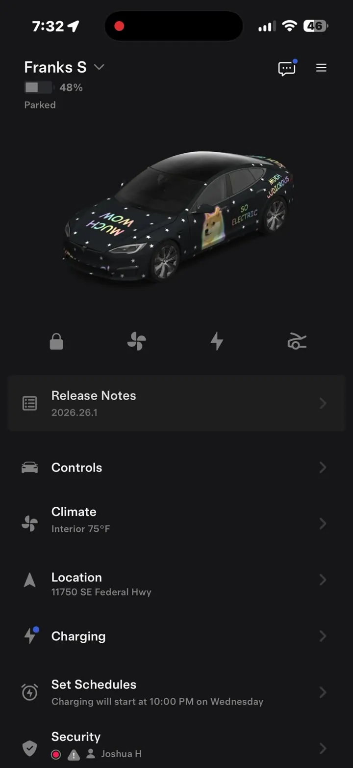 The Tesla app home screen showing a Model S wearing a custom black wrap with doge artwork